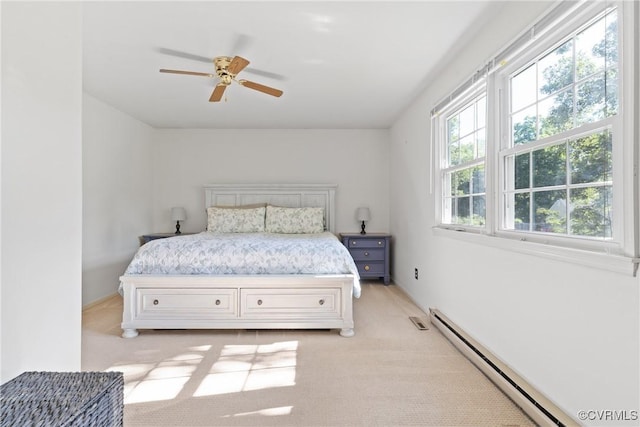 3601 Egan Rd, Chesterfield, VA 23832 - bedroom featuring a baseboard heating unit, light colored carpet, and ceiling fan