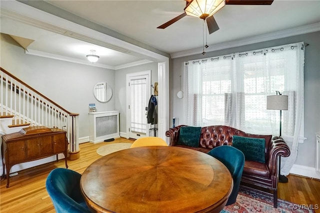 3102 W Grace St, Richmond, VA 23221 - dining room featuring ceiling fan, wood finished floors, crown molding, and stairway