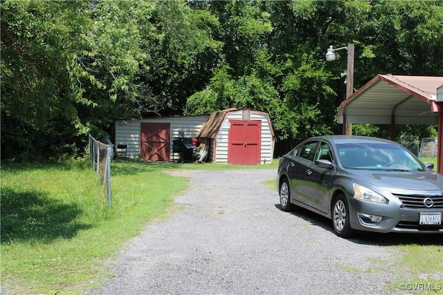 1319 Halifax St, Petersburg, VA 23803 - exterior space with a storage shed and a carport