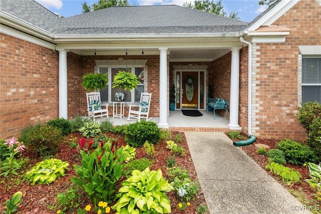 9316 Crossover Dr, Mechanicsville, VA 23116 - entrance to property featuring covered porch, brick siding, and roof with shingles
