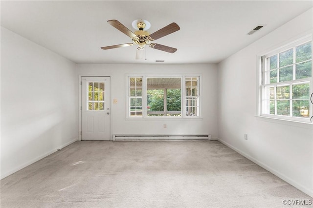 5984 Canterbury Rd, Walkerton, VA 23177 - empty room with baseboard heating, carpet floors, and a ceiling fan