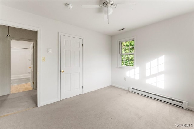 5984 Canterbury Rd, Walkerton, VA 23177 - unfurnished bedroom featuring a baseboard heating unit, carpet flooring, and ceiling fan
