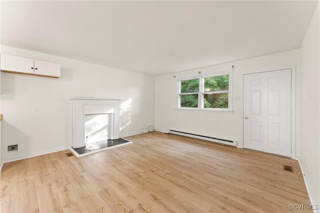 5994 Canterbury Rd, Walkerton, VA 23177 - unfurnished living room with baseboard heating and light wood-style floors