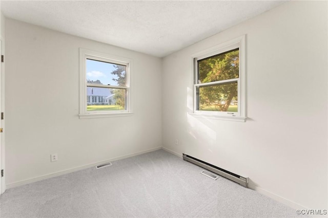 5994 Canterbury Rd, Walkerton, VA 23177 - unfurnished room featuring light carpet, a textured ceiling, and a baseboard radiator