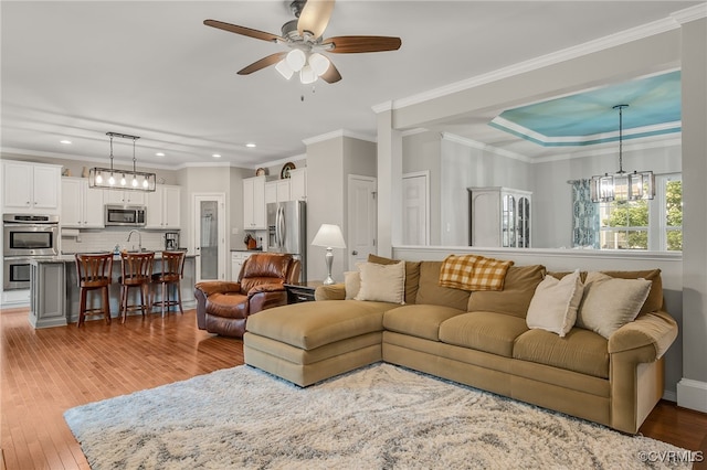 14919 Bayfront Pl, Midlothian, VA 23112 - living area featuring recessed lighting, light wood-style floors, a ceiling fan, ornamental molding, and a chandelier