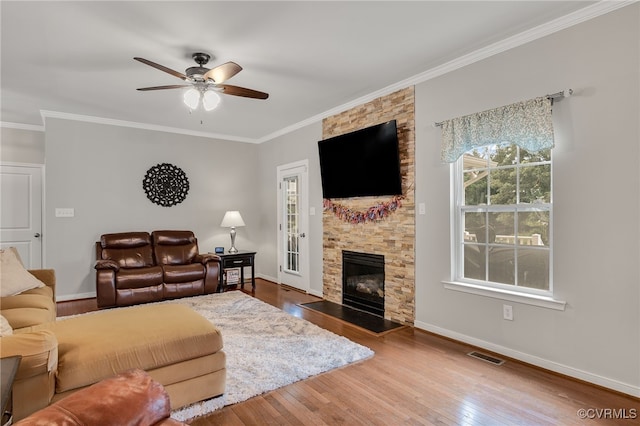 14919 Bayfront Pl, Midlothian, VA 23112 - living room featuring a ceiling fan, crown molding, wood-type flooring, and a fireplace