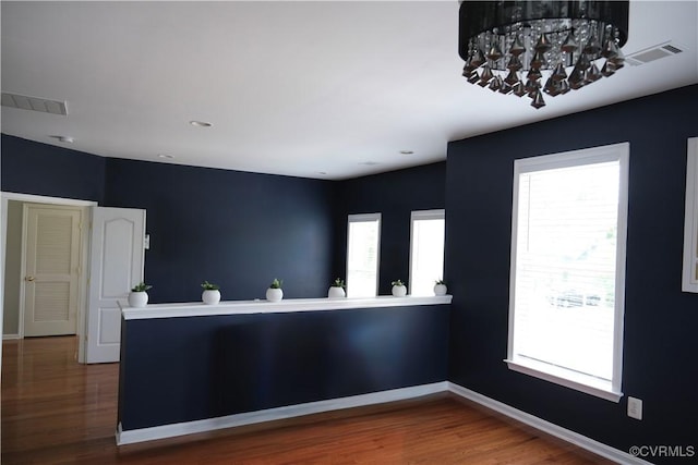 43314 Fullerton St, Ashburn, VA 20147 - kitchen featuring wood finished floors, plenty of natural light, and a chandelier