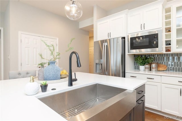 5024 Rivermere Ln, Glen Allen, VA 23059 - kitchen featuring stainless steel fridge with ice dispenser, built in microwave, light countertops, backsplash, and white cabinets