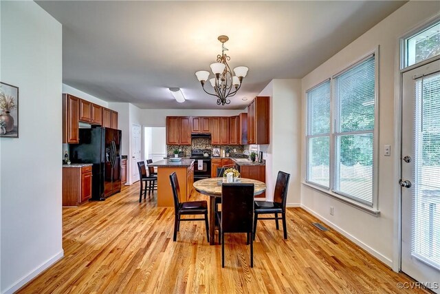 5408 Woolshire Dr, Glen Allen, VA 23059 - dining space with light wood-style floors and a chandelier
