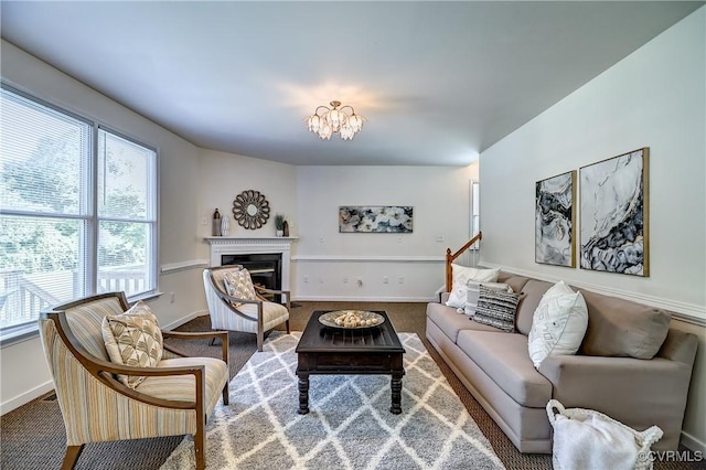 5408 Woolshire Dr, Glen Allen, VA 23059 - living area featuring carpet floors, a chandelier, and a glass covered fireplace