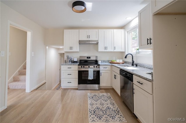 4205 W End Dr, Henrico, VA 23294 - kitchen featuring appliances with stainless steel finishes, light stone counters, light wood-style flooring, and white cabinetry