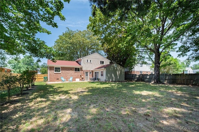 4205 W End Dr, Henrico, VA 23294 - back of house with a fenced backyard and brick siding