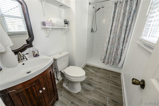 9286 Hungary Rd, Glen Allen, VA 23060 - bathroom featuring vanity, tiled shower, and wood tiled floors