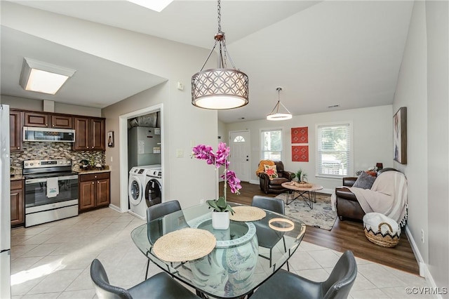 9286 Hungary Rd, Glen Allen, VA 23060 - dining room featuring independent washer and dryer, light tile patterned floors, lofted ceiling, and water heater