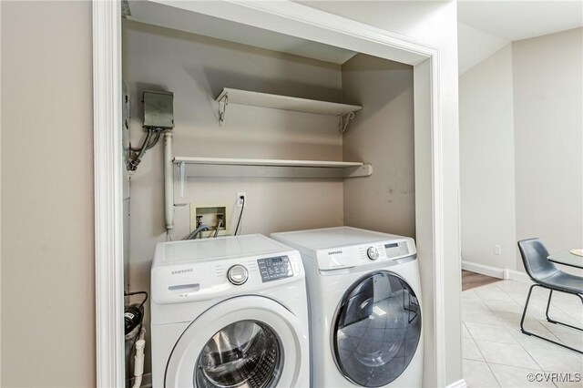 9286 Hungary Rd, Glen Allen, VA 23060 - laundry area featuring washer and dryer and light tile patterned flooring