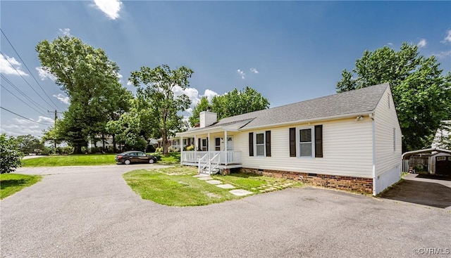 9286 Hungary Rd, Glen Allen, VA 23060 - view of front facade with covered porch, crawl space, a chimney, a detached carport, and asphalt driveway