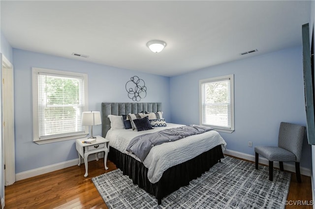 9286 Hungary Rd, Glen Allen, VA 23060 - bedroom featuring multiple windows and wood finished floors