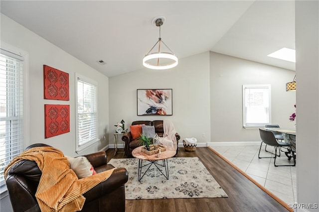 9286 Hungary Rd, Glen Allen, VA 23060 - living room featuring lofted ceiling, a skylight, and wood finished floors
