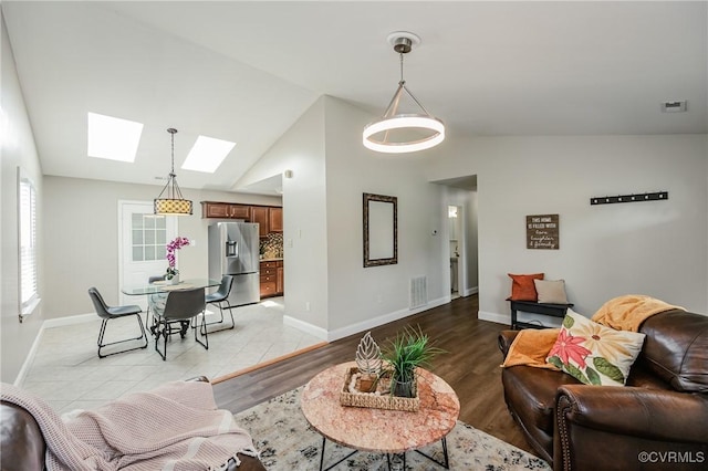 9286 Hungary Rd, Glen Allen, VA 23060 - living room with a skylight, vaulted ceiling, and light wood-style flooring