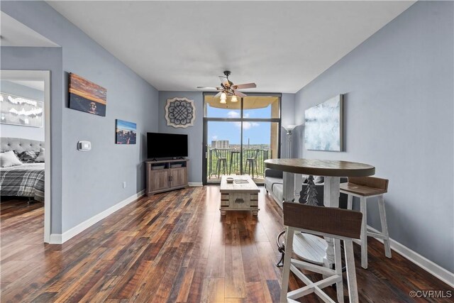 1101 Haxall Pt Unit U712, Richmond, VA 23219 - living area with dark wood-style floors, a wall of windows, and a ceiling fan