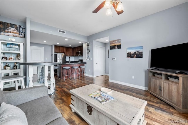 1101 Haxall Pt Unit U712, Richmond, VA 23219 - living area featuring a ceiling fan and dark wood finished floors