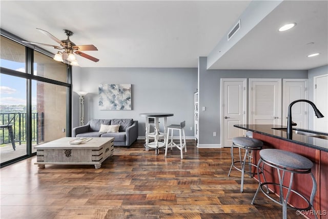 1101 Haxall Pt Unit U712, Richmond, VA 23219 - living room featuring floor to ceiling windows, a ceiling fan, dark wood-type flooring, and recessed lighting