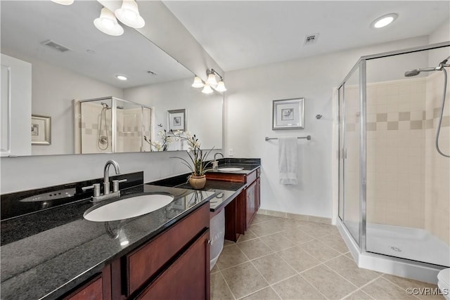 1101 Haxall Pt Unit U712, Richmond, VA 23219 - bathroom with a stall shower, double vanity, and tile patterned flooring