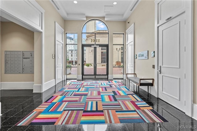 1101 Haxall Pt Unit U712, Richmond, VA 23219 - foyer entrance with granite tiled floors, recessed lighting, and mail area