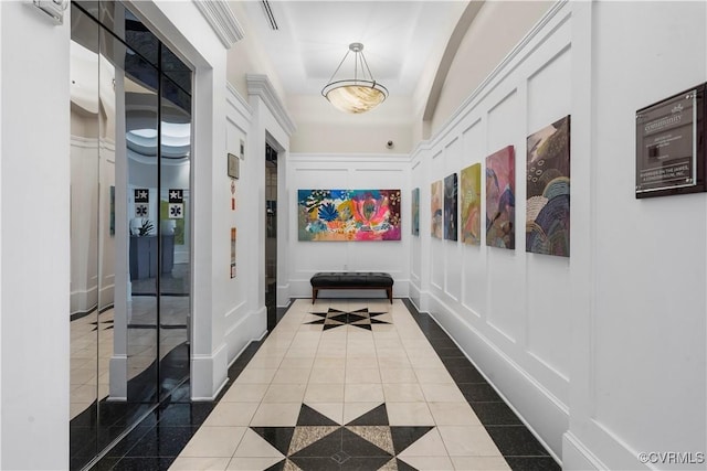 1101 Haxall Pt Unit U712, Richmond, VA 23219 - corridor with inlaid floor details, dark tile patterned flooring, and a decorative wall