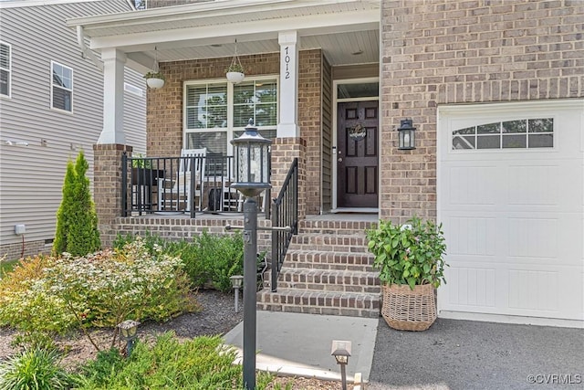 7012 Hapsburg Ct, Henrico, VA 23231 - view of exterior entry with covered porch, brick siding, and an attached garage