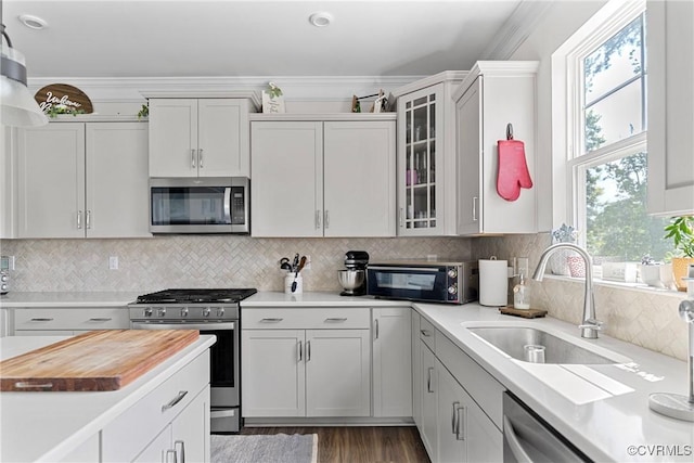 7012 Hapsburg Ct, Henrico, VA 23231 - kitchen with stainless steel appliances, glass insert cabinets, dark wood-type flooring, decorative backsplash, and white cabinetry