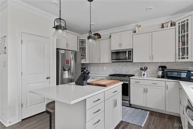 7012 Hapsburg Ct, Henrico, VA 23231 - kitchen with stainless steel appliances, dark wood-style flooring, a center island, light countertops, and decorative backsplash