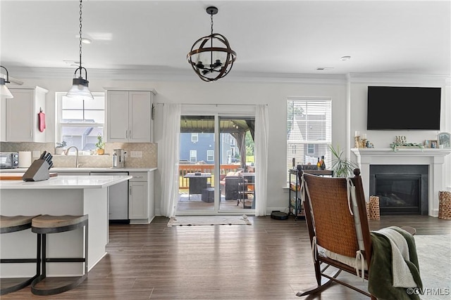 7012 Hapsburg Ct, Henrico, VA 23231 - kitchen with dishwasher, light countertops, tasteful backsplash, hanging light fixtures, and ornamental molding