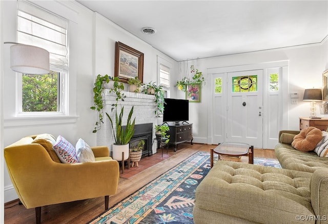 4006 Chevy Chase St, Richmond, VA 23227 - living room with a wood stove and wood finished floors