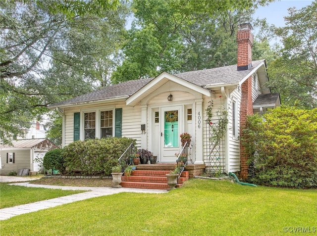 4006 Chevy Chase St, Richmond, VA 23227 - bungalow featuring a front yard, a chimney, and a shingled roof