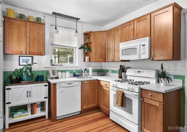 4006 Chevy Chase St, Richmond, VA 23227 - kitchen featuring white appliances, open shelves, light wood-style flooring, and brown cabinetry