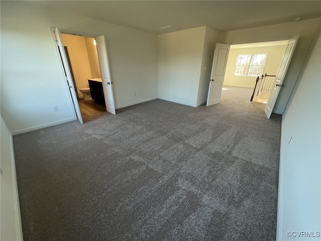 4913 Bailey Woods Ln, Midlothian, VA 23112 - spare room with baseboards and dark colored carpet