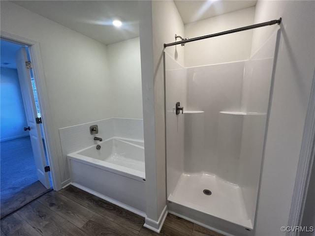 4913 Bailey Woods Ln, Midlothian, VA 23112 - bathroom with wood finished floors, a bath, and a shower