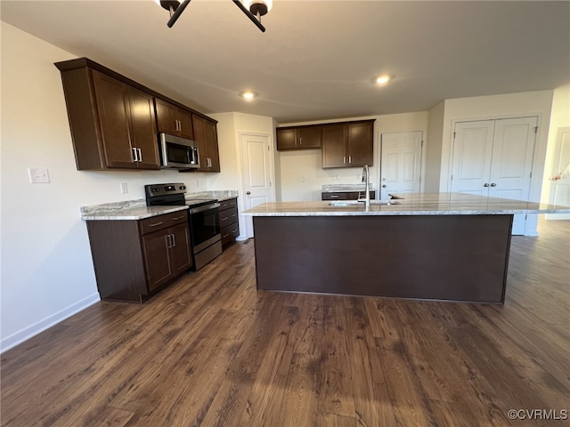 4913 Bailey Woods Ln, Midlothian, VA 23112 - kitchen featuring appliances with stainless steel finishes, dark brown cabinets, dark wood-style flooring, a center island with sink, and recessed lighting