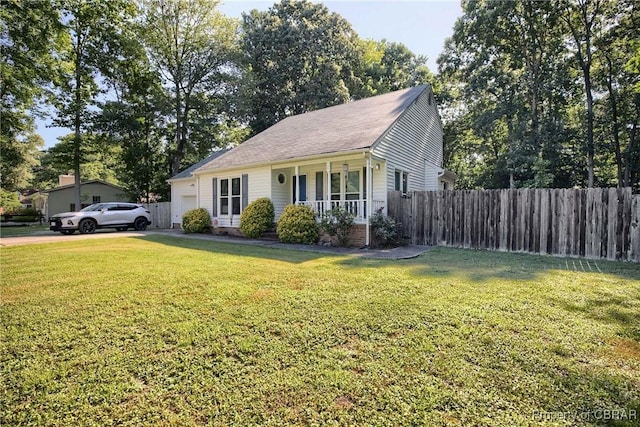 8187 Lord Fairfax Cir, Gloucester, VA 23061 - view of front facade with a porch, a garage, and driveway