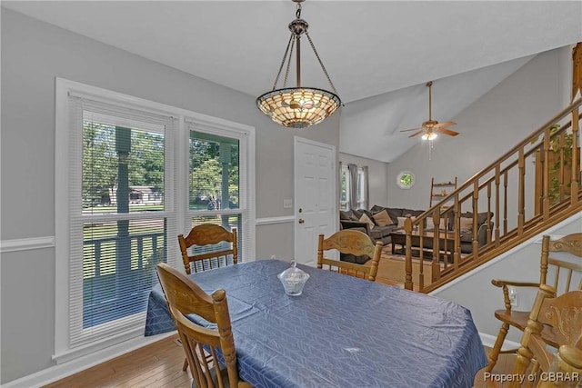 8187 Lord Fairfax Cir, Gloucester, VA 23061 - dining area featuring lofted ceiling, hardwood / wood-style floors, stairs, and a ceiling fan