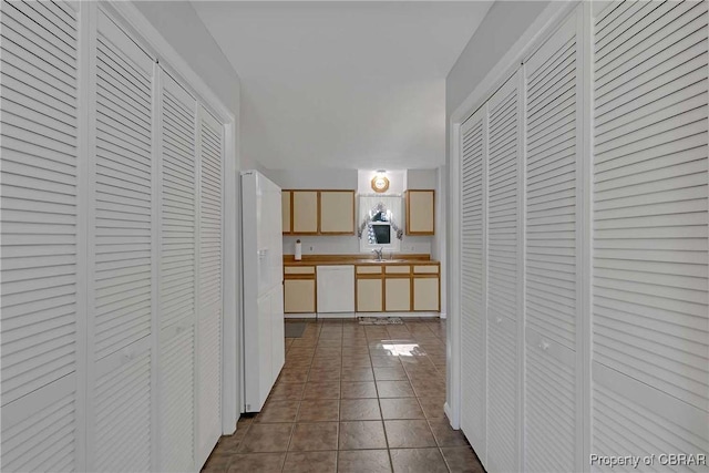 8187 Lord Fairfax Cir, Gloucester, VA 23061 - hall with a sink and dark tile patterned flooring