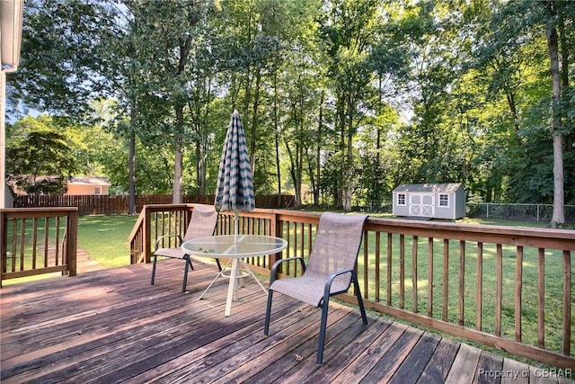 8187 Lord Fairfax Cir, Gloucester, VA 23061 - deck with a fenced backyard, a shed, outdoor dining space, and view of scattered trees