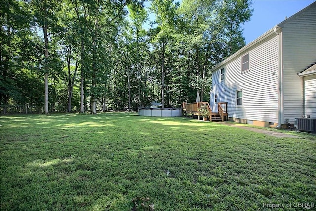 8187 Lord Fairfax Cir, Gloucester, VA 23061 - view of green lawn with a wooden deck and an outdoor pool