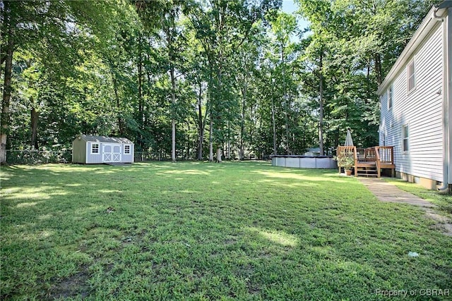 8187 Lord Fairfax Cir, Gloucester, VA 23061 - fenced backyard with a shed, a deck, and an outdoor pool