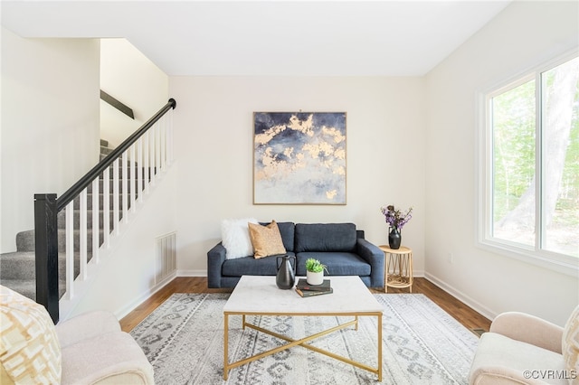 7133 Swindale Ct, Mechanicsville, VA 23116 - living area featuring plenty of natural light, stairway, and wood finished floors