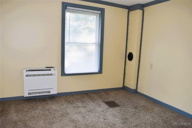 1642 Free State Rd, Meherrin, VA 23954 - spare room with heating unit, carpet floors, and crown molding