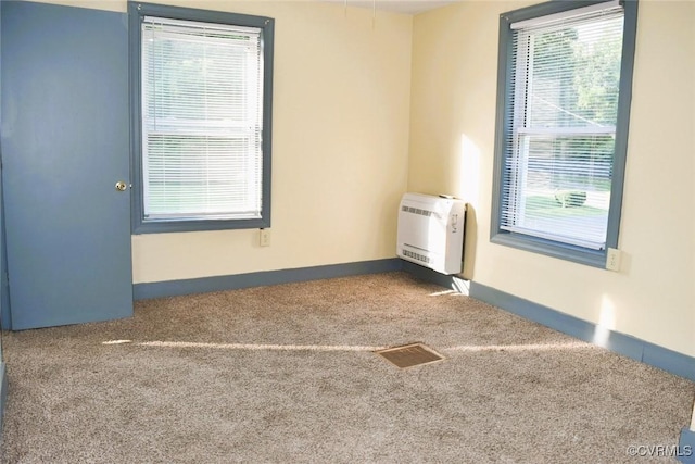 1642 Free State Rd, Meherrin, VA 23954 - carpeted empty room with heating unit and baseboards