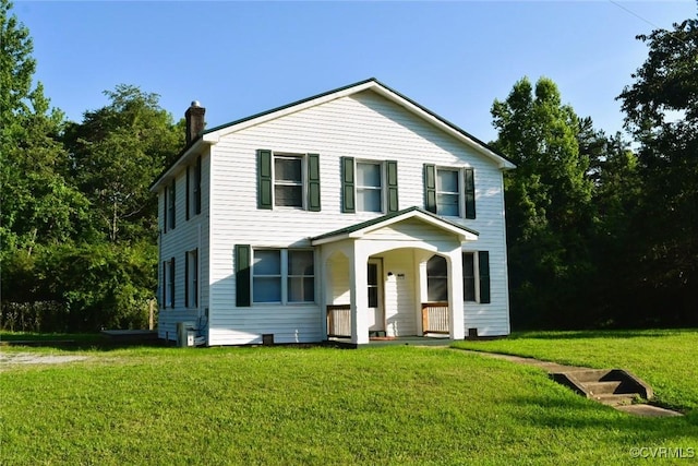 1642 Free State Rd, Meherrin, VA 23954 - view of front of house featuring a chimney, a front yard, and a porch