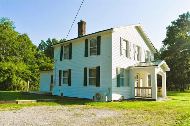 1642 Free State Rd, Meherrin, VA 23954 - back of house with a chimney, a lawn, and a porch